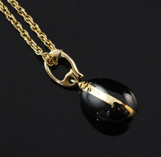 A Victor Mayer for Faberge 18ct gold, black onyx and diamond set egg pendant on 9ct gold chain,